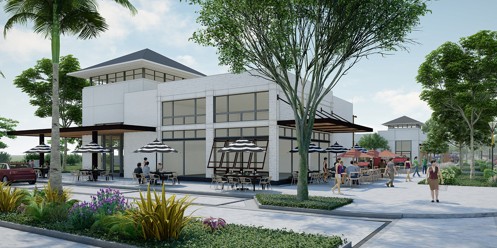 Modern commercial building with outdoor seating and greenery.